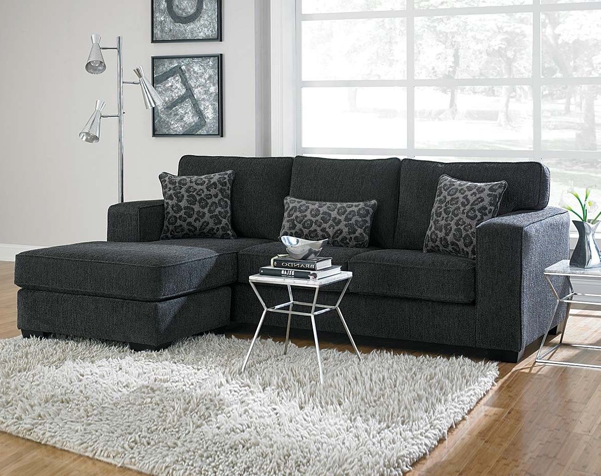 This Dark Gray Sectional Sofa Is Covered In A Soft Chenille And Regarding Widely Used Layaway Sectional Sofas (Photo 1 of 15)