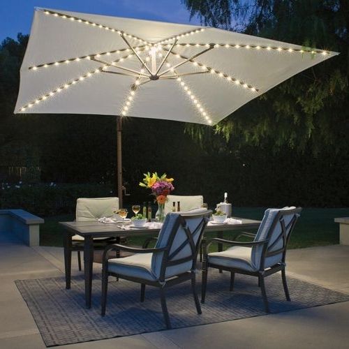 Sunbrella Patio Umbrellas With Solar Lights For Newest Bali Pro 10' Square Rotating Cantilever Umbrella With Lights (View 1 of 15)