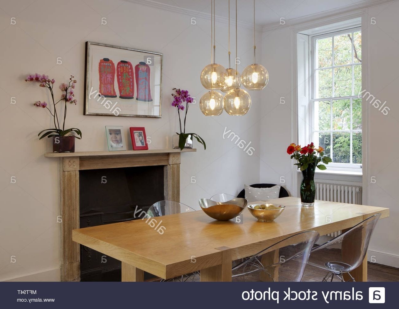 Famous Pendant Lights Above Wooden Dining Table With Eames Transparent With Dining Lights Above Dining Tables (Photo 20 of 25)