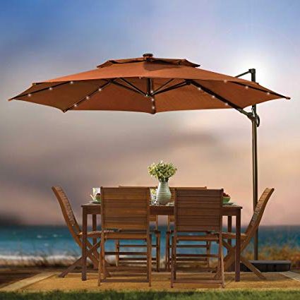 Recent Jendayi Square Cantilever Umbrellas Intended For Outdoor Patio Cantilever Umbrella 11 Foot Round Canopy With Solar Powered  Lights Includes Base And Storage Cover (Terracotta) (View 16 of 25)