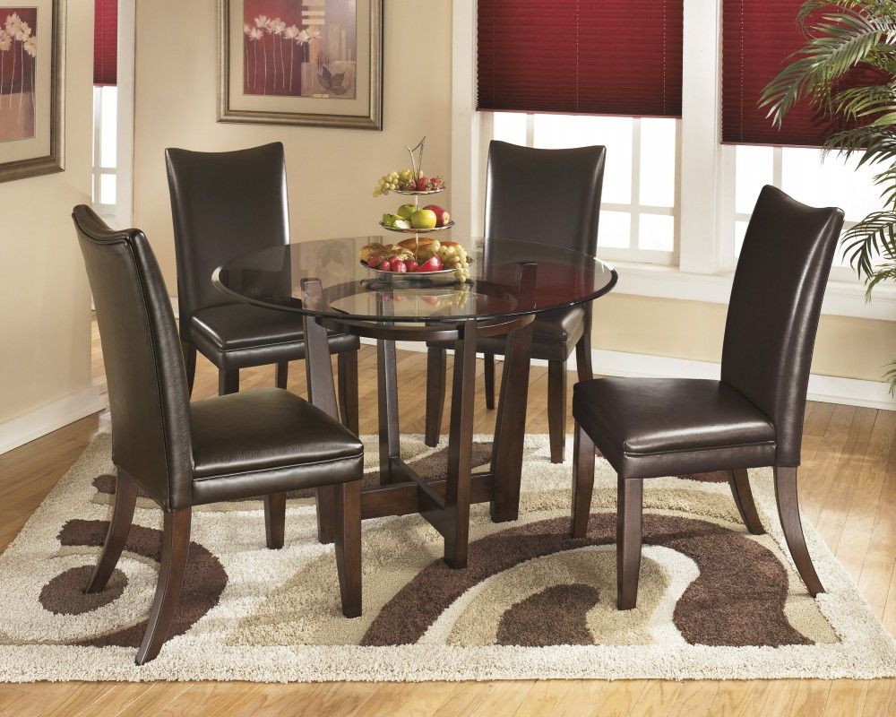 Griffin Reclaimed Wood Dining Tables In Well Known Charrell Round Dining Room Table & 4 Medium Brown Uph Side Chairs (View 16 of 25)