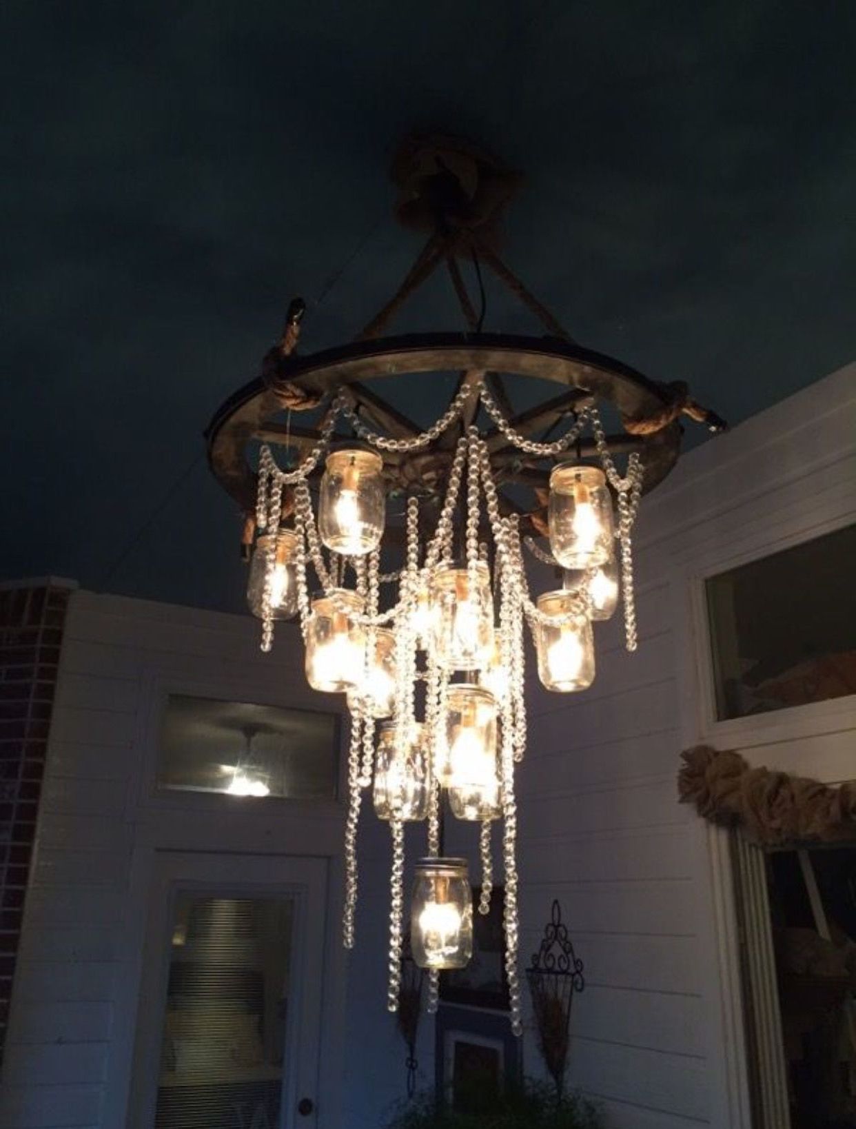 Well Known Wagon Wheel Chandelier With Mason Jars & Strings Of Regarding Wagon Wheel Chandeliers (View 15 of 15)