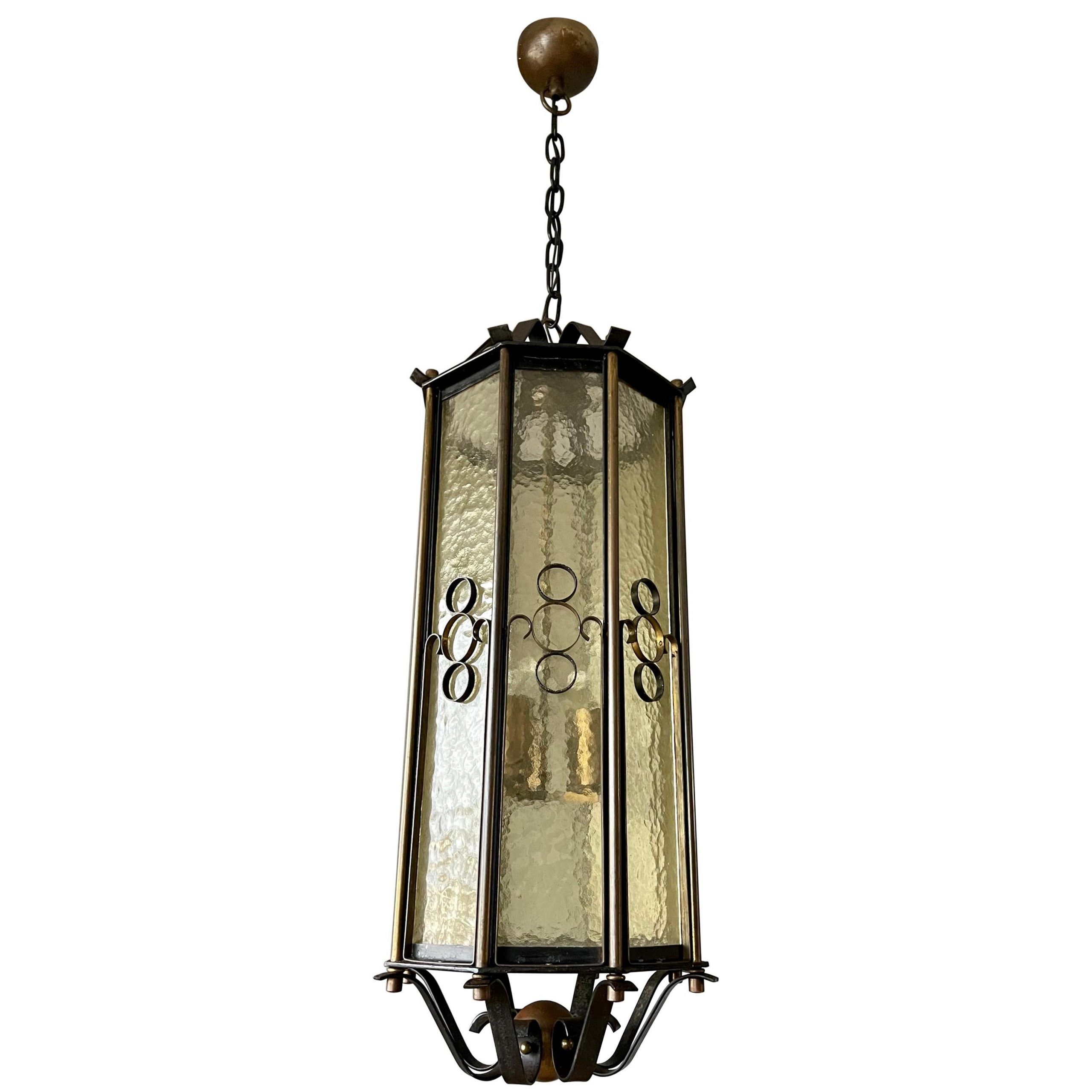 Forged Iron Lantern Chandeliers With Regard To Recent Extra Large Brass And Wrought Iron Lantern / Pendant With Cathedral Glass,  1930s For Sale At 1stdibs (View 8 of 15)