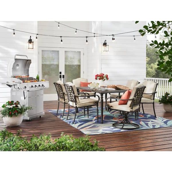 Oaks Table Set With Patio Cover Inside Well Liked Hampton Bay Laurel Oaks 7 Piece Brown Steel Outdoor Patio Dining Set With  Cushionguard Putty Tan Cushions 525.0200.002 – The Home Depot (Photo 14 of 15)